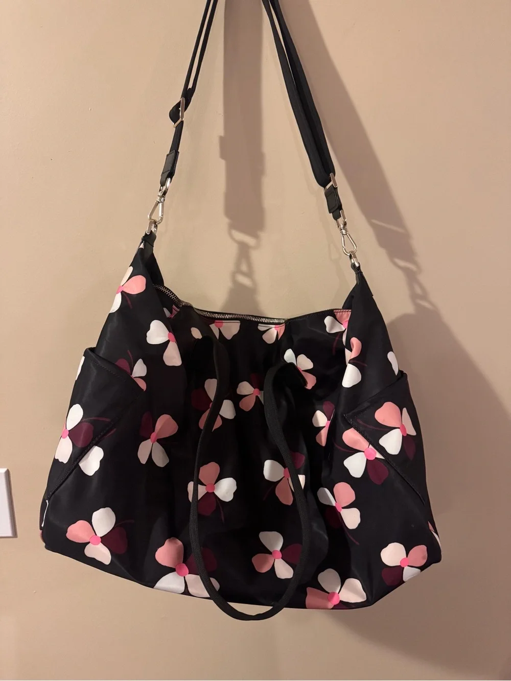 Kate Spade Dawn Dusk Buds Weekender Bag in black with pink floral